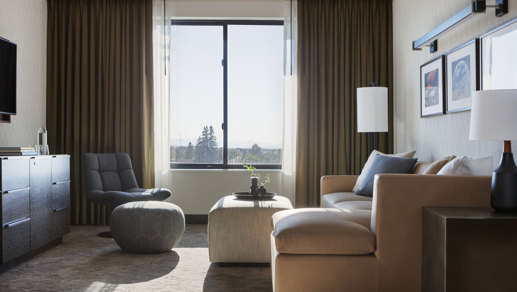 suite living room with couch and mountain views