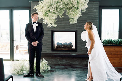 a couple kissing under a tree of flowers