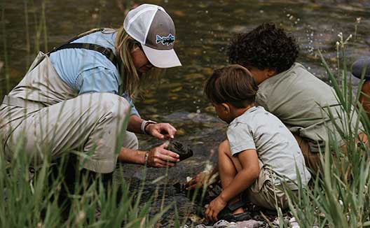 guide with kids on river